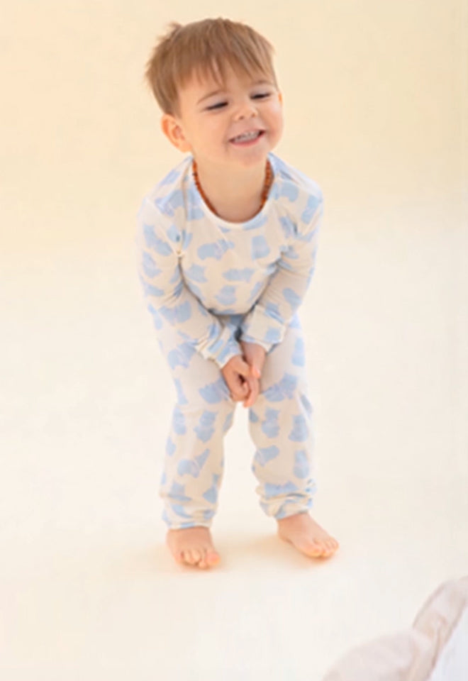Baby wearing a 2 piece PJ Set. Button leads to the PJ Set collection.