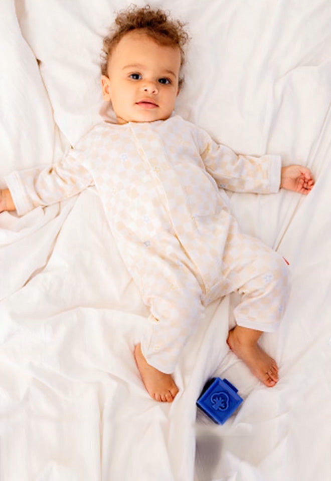 Baby wearing a Romper. button leads to the Daywear collection.