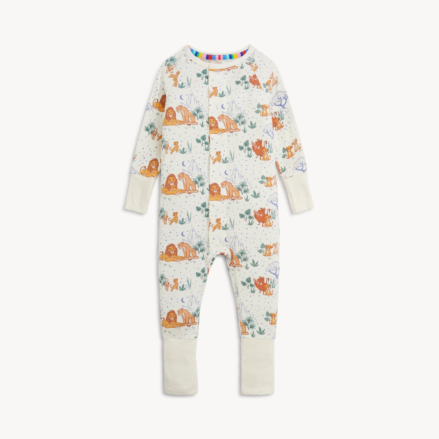 A cream-colored long-sleeve coverall featuring a repeating pattern of Disney Pumbaa, Simba, and Nala among savanna trees and blue stars by Magnetic Me.
