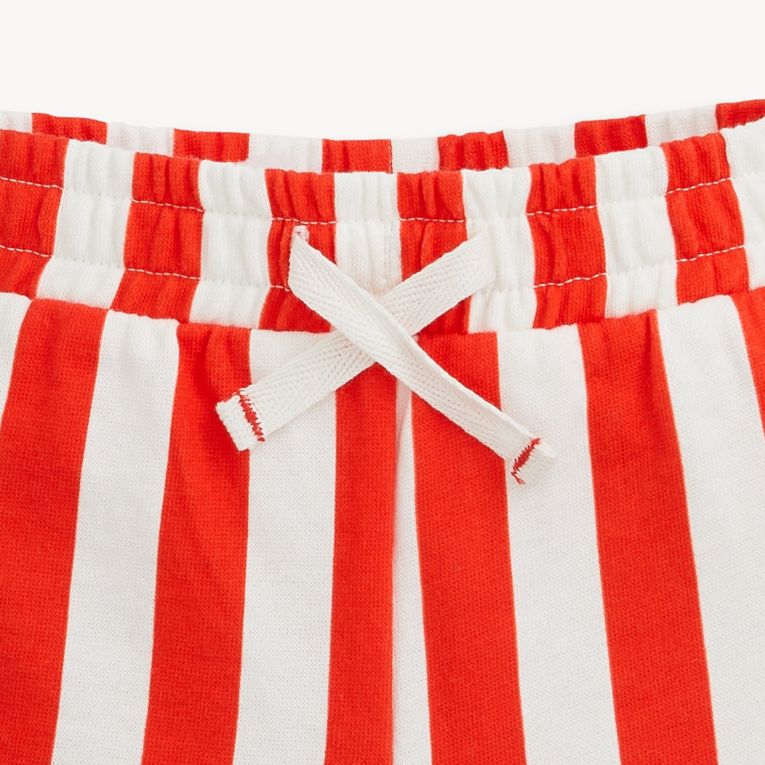 Red-and-white striped French terry shorts by Magnetic Me.
