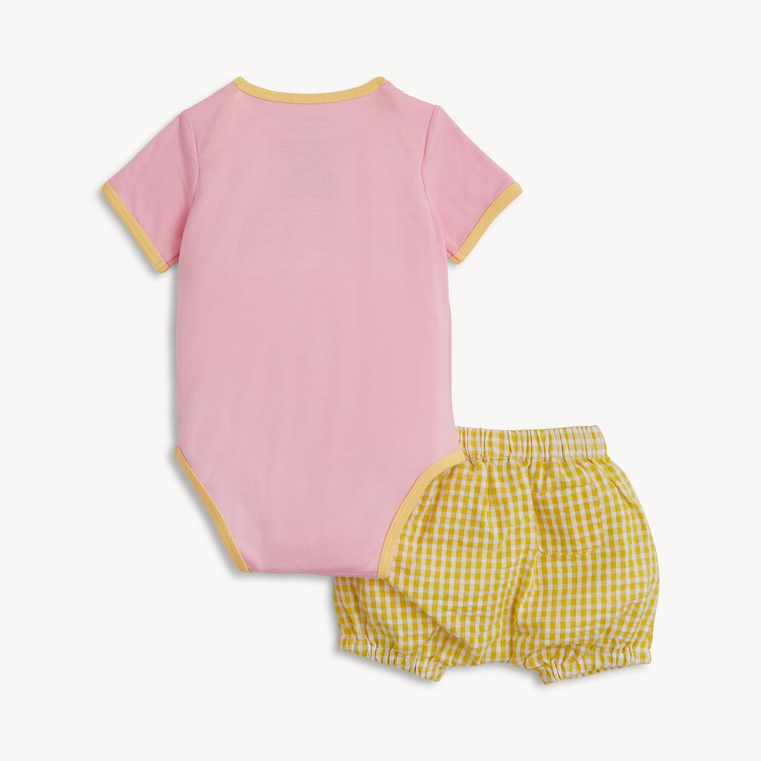 Back of A two-piece set featuring a pink short-sleeve bodysuit with yellow trim and matching yellow gingham bloomers with a functional back pocket, by Magnetic Me.