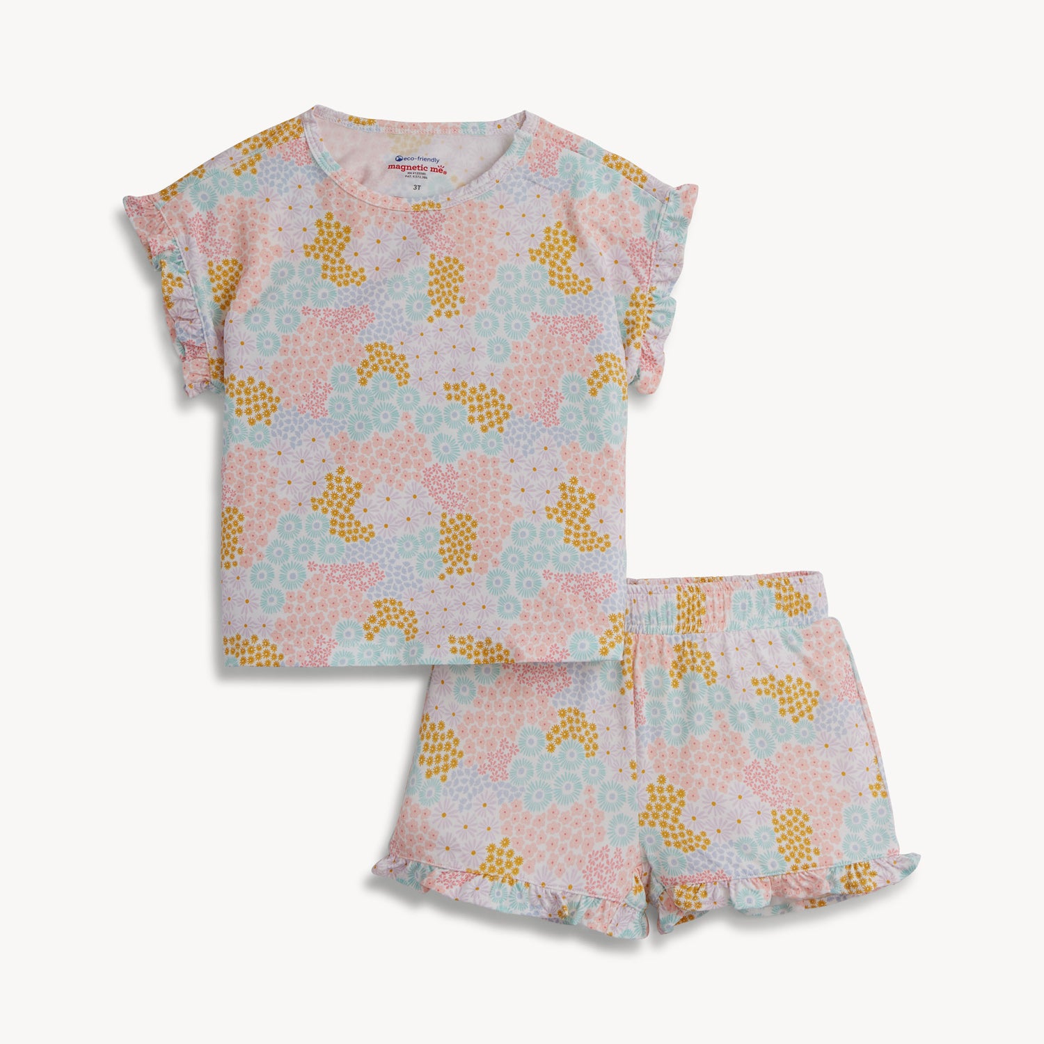 A child's short set including a ruffle-sleeve top and matching ruffled shorts in a colorful pastel floral print with pink and gold accents, by Magnetic Me.