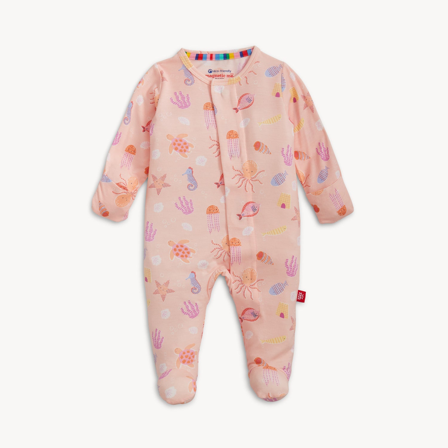 A pink long-sleeve footie with a magnetic closure and an all-over print of various sea creatures including turtles and jellyfish by Magnetic Me.