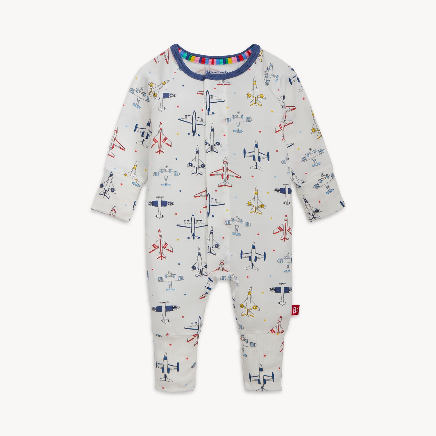 A white long-sleeve baby convertible coverall with an airplane pattern featuring convertible fold-over mittens and foot cuffs by Magnetic Me.