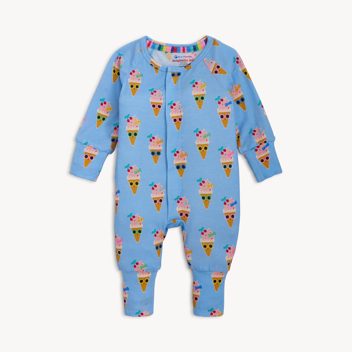 A cornflower blue long-sleeved convertible coverall with integrated mittens and cuffs, decorated with a repeat pattern of whimsical ice cream cones in sunglasses, by Magnetic Me.