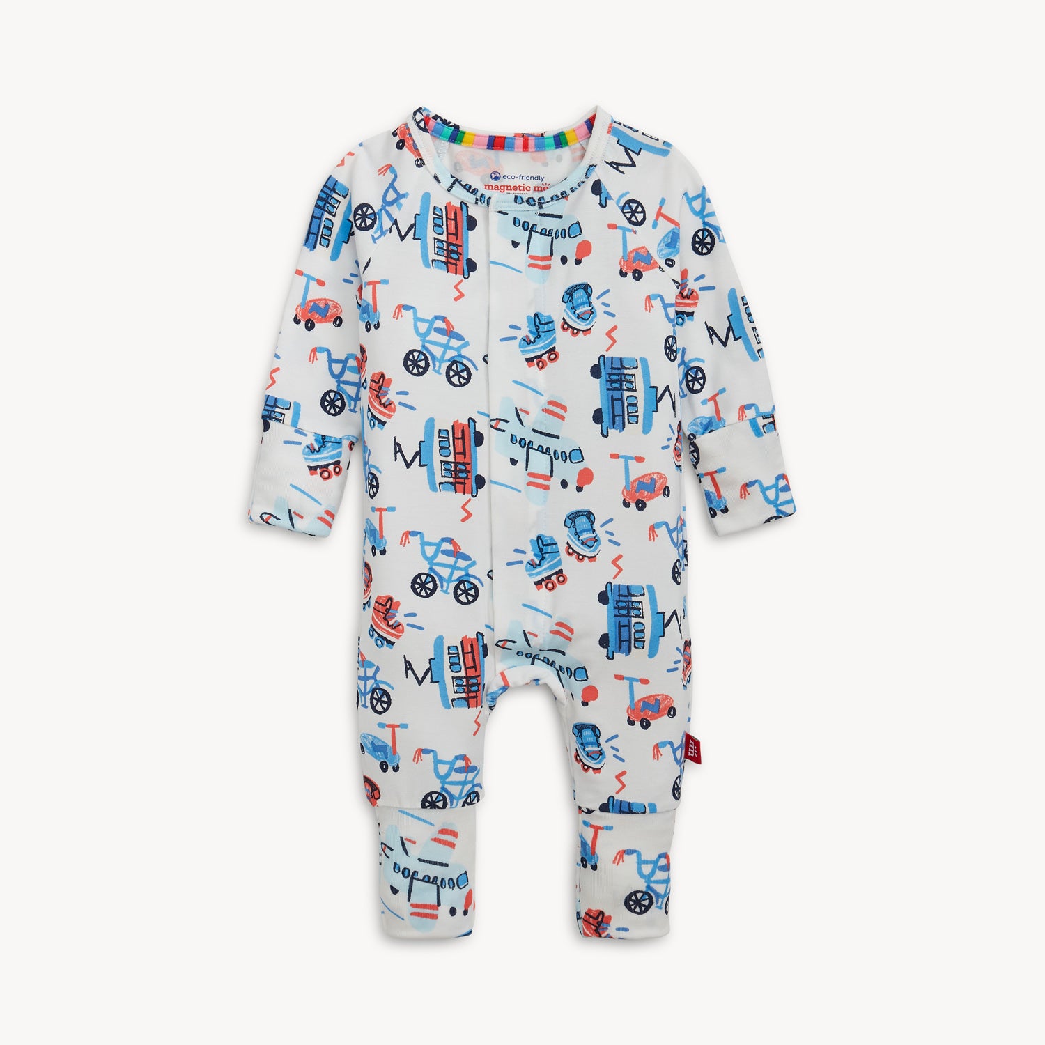 A white long-sleeved one-piece convertible coverall with open cuffs and a whimsical transportation print of blue bicycles and red trolley cars, by Magnetic Me.
