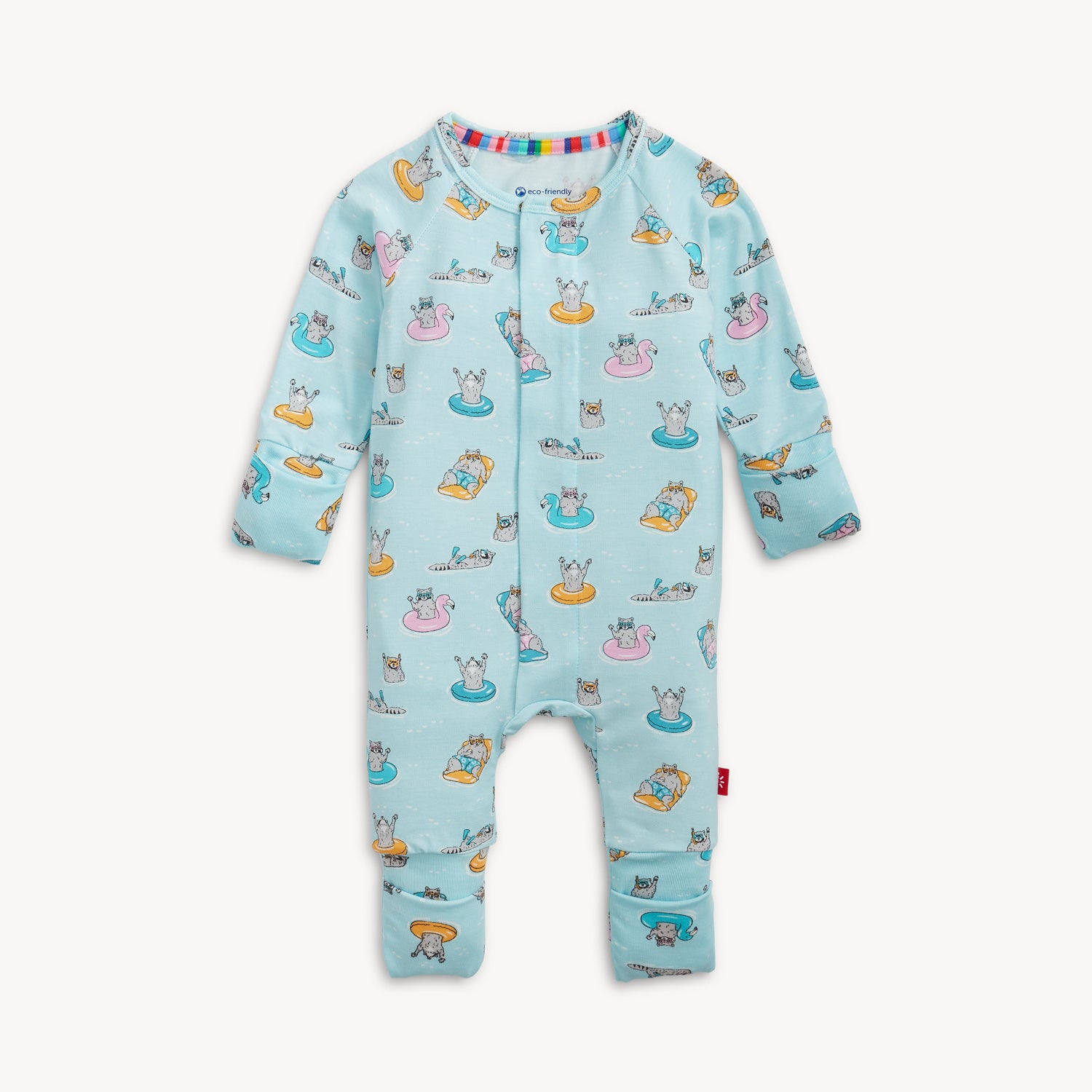 A light blue convertible coverall with a whimsical pattern of raccoons relaxing on pool rafts and swimming, by Magnetic Me.
