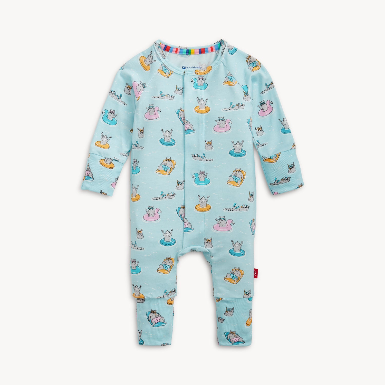 A light blue convertible coverall with a whimsical pattern of raccoons relaxing on pool rafts and swimming, by Magnetic Me.