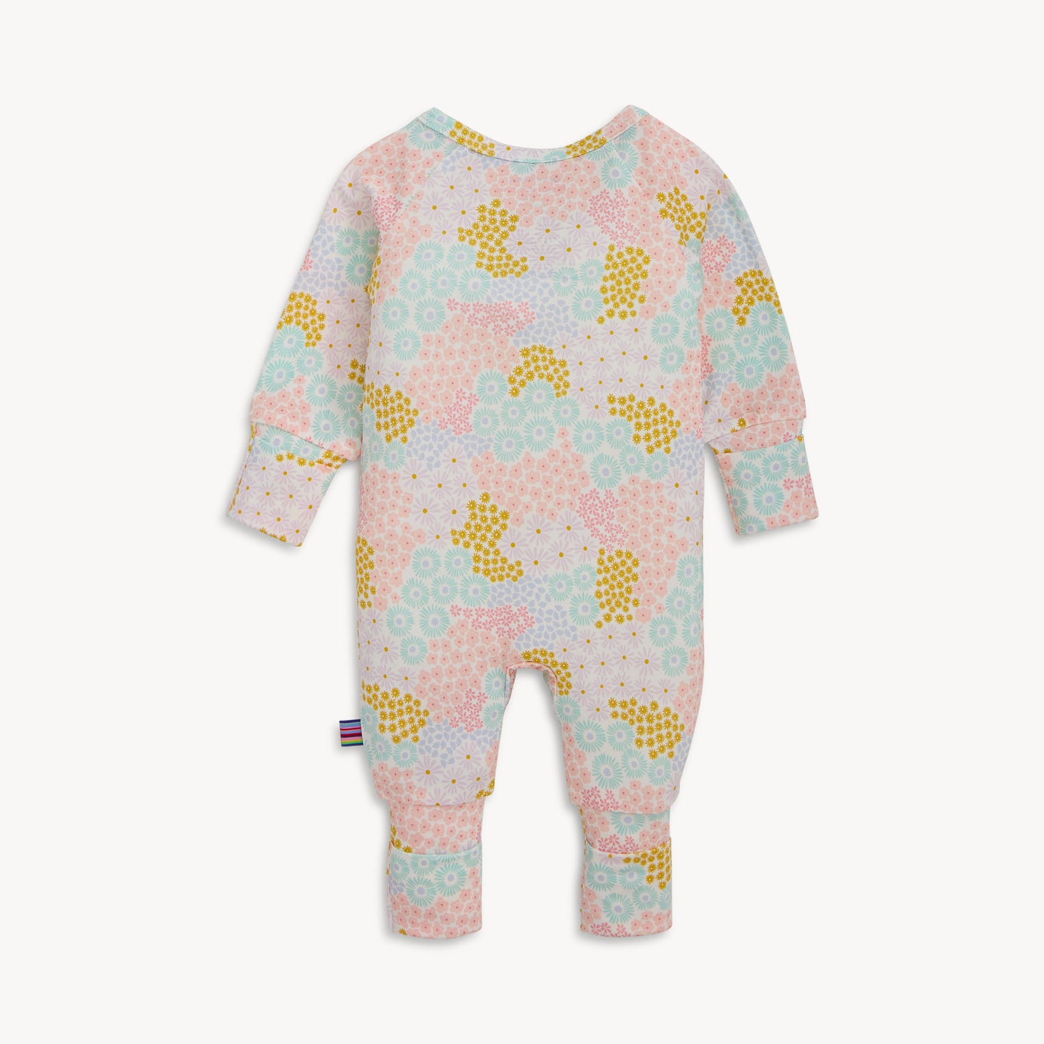 Back of A long-sleeve convertible coverall with ruffle detailing and a multi-colored pastel floral pattern, by Magnetic Me.