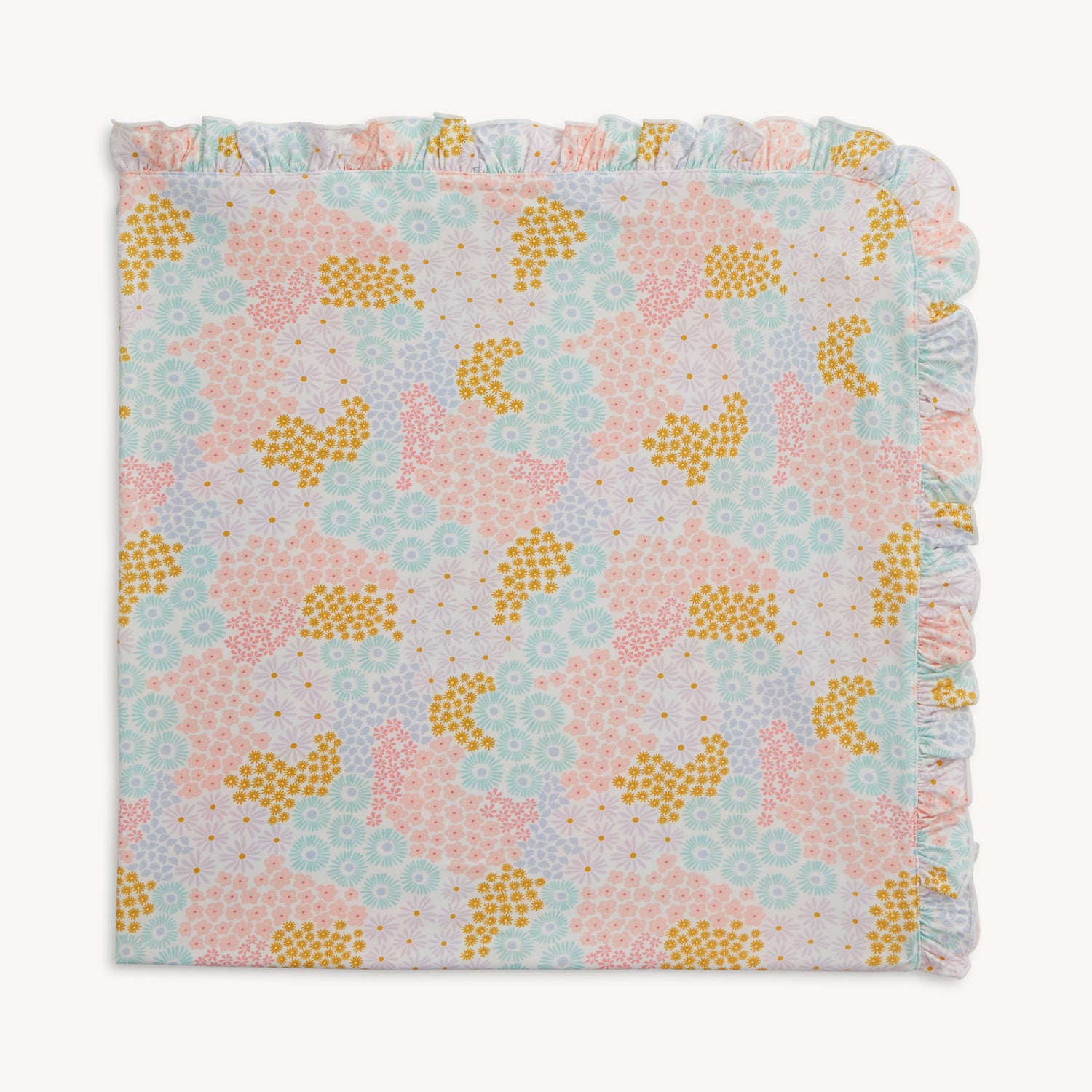 A 30" x 30" baby blanket with a wide ruffle border featuring a dense pattern of pink, yellow, and blue flowers on a white background, by Magnetic Me.