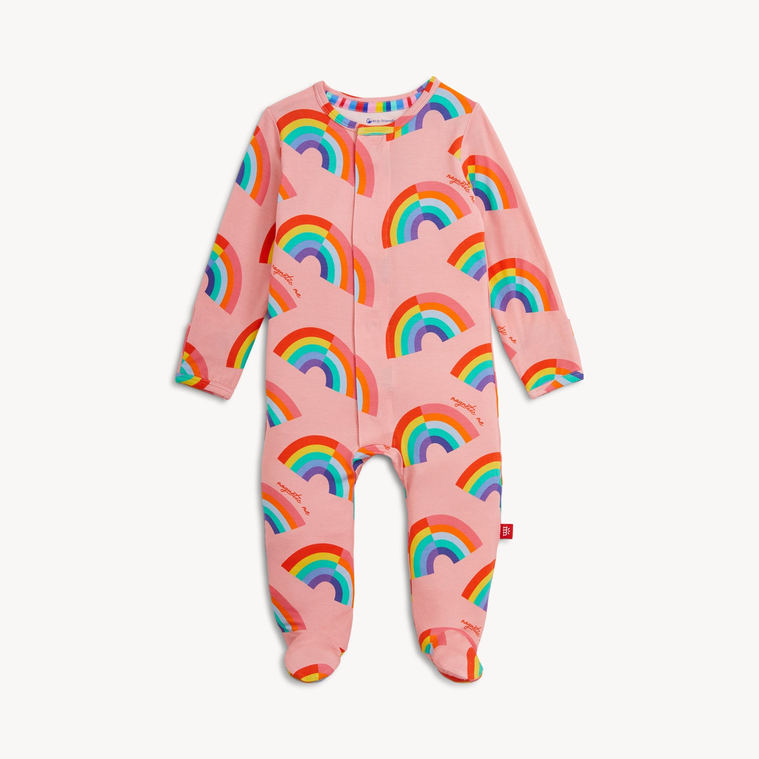A long-sleeve pink footie featuring a repeating pattern of vibrant, multi-colored rainbows, by Magnetic Me.