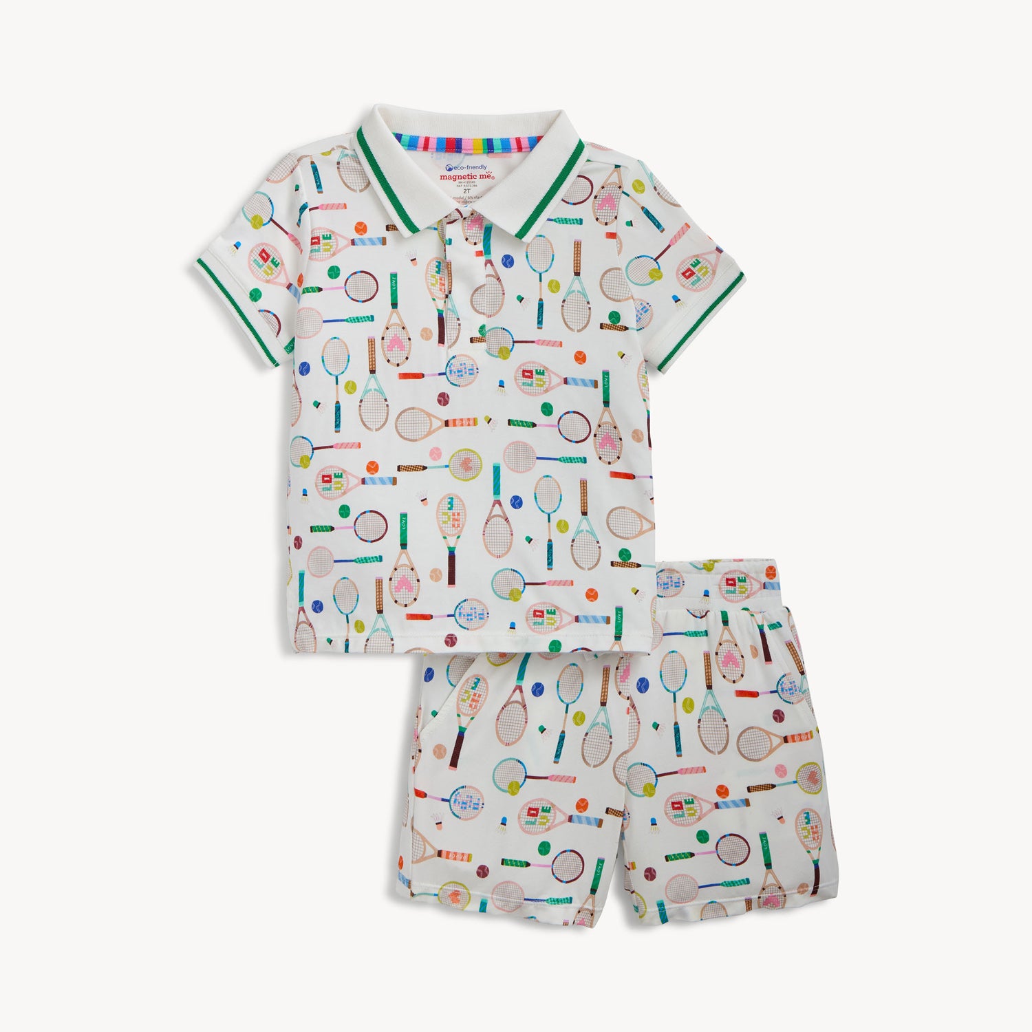 A two-piece set including a cream polo-style short-sleeve top and matching shorts with a vibrant tennis-themed equipment print, by Magnetic Me.
