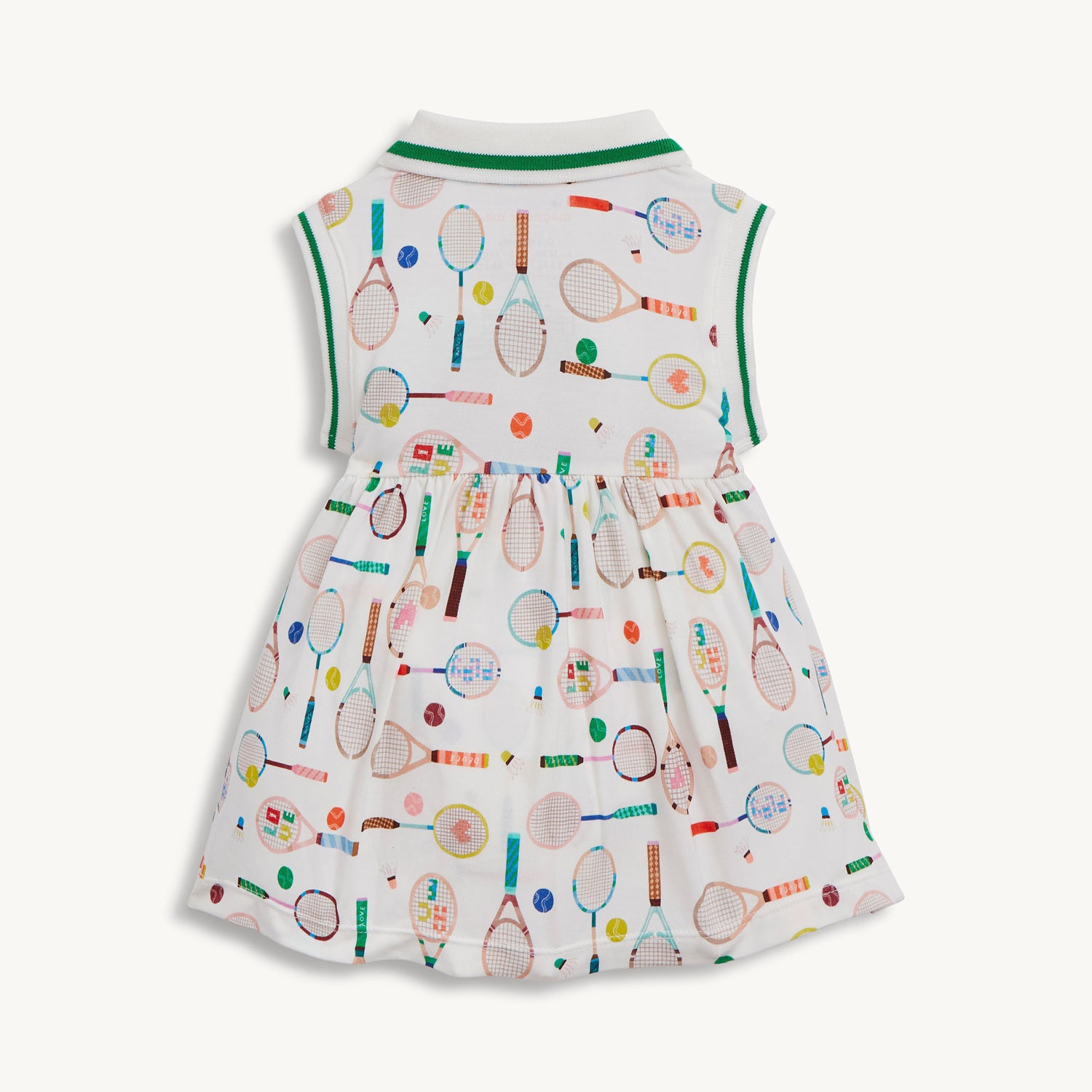 Back of A sleeveless cream-colored dress with a pink-trimmed polo collar and an integrated bodysuit, featuring a colorful print of tennis rackets, balls, and shuttlecocks, by Magnetic Me.