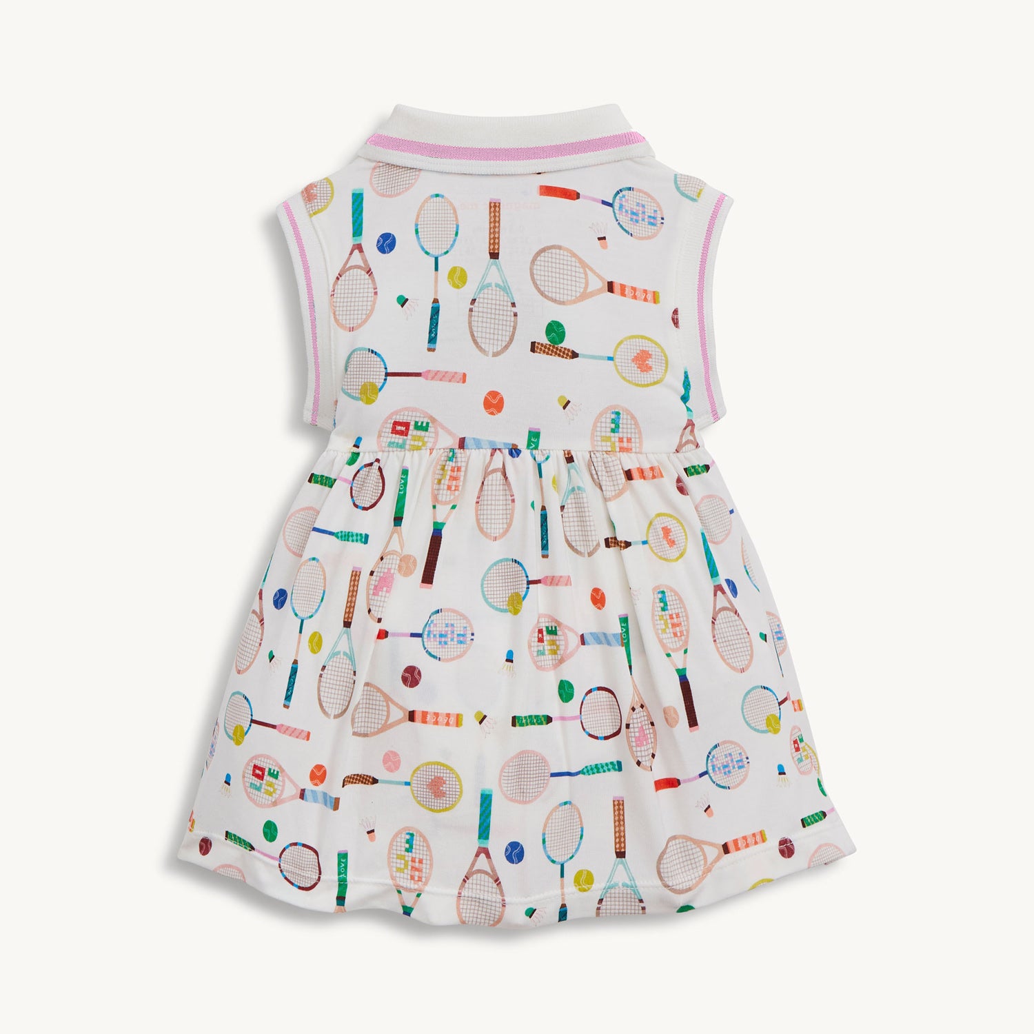 Back of A sleeveless cream-colored dress with a pink-trimmed polo collar and an integrated bodysuit, featuring a colorful print of tennis rackets, balls, and shuttlecocks, by Magnetic Me.