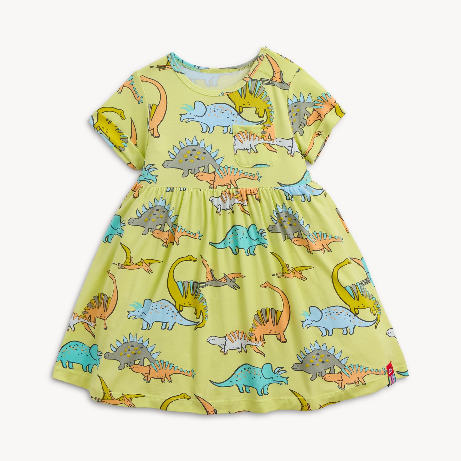 A lime green A-line dress for girls featuring a chest pocket and a playful print of diverse, multi-colored dinosaurs, by Magnetic Me.