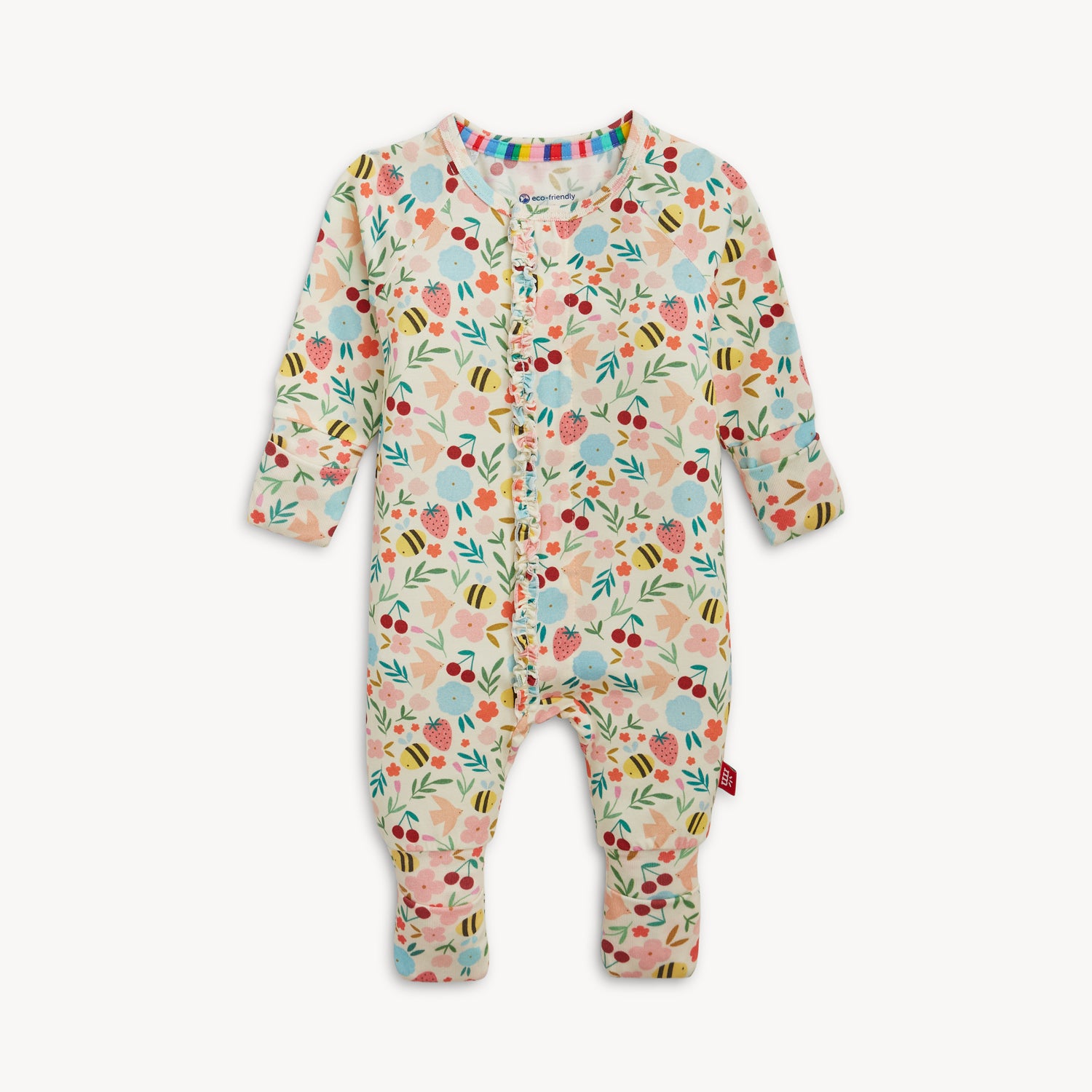 A long-sleeve convertible coverall featuring a vibrant bee and botanical garden print with a ruffled magnetic front, by Magnetic Me.
