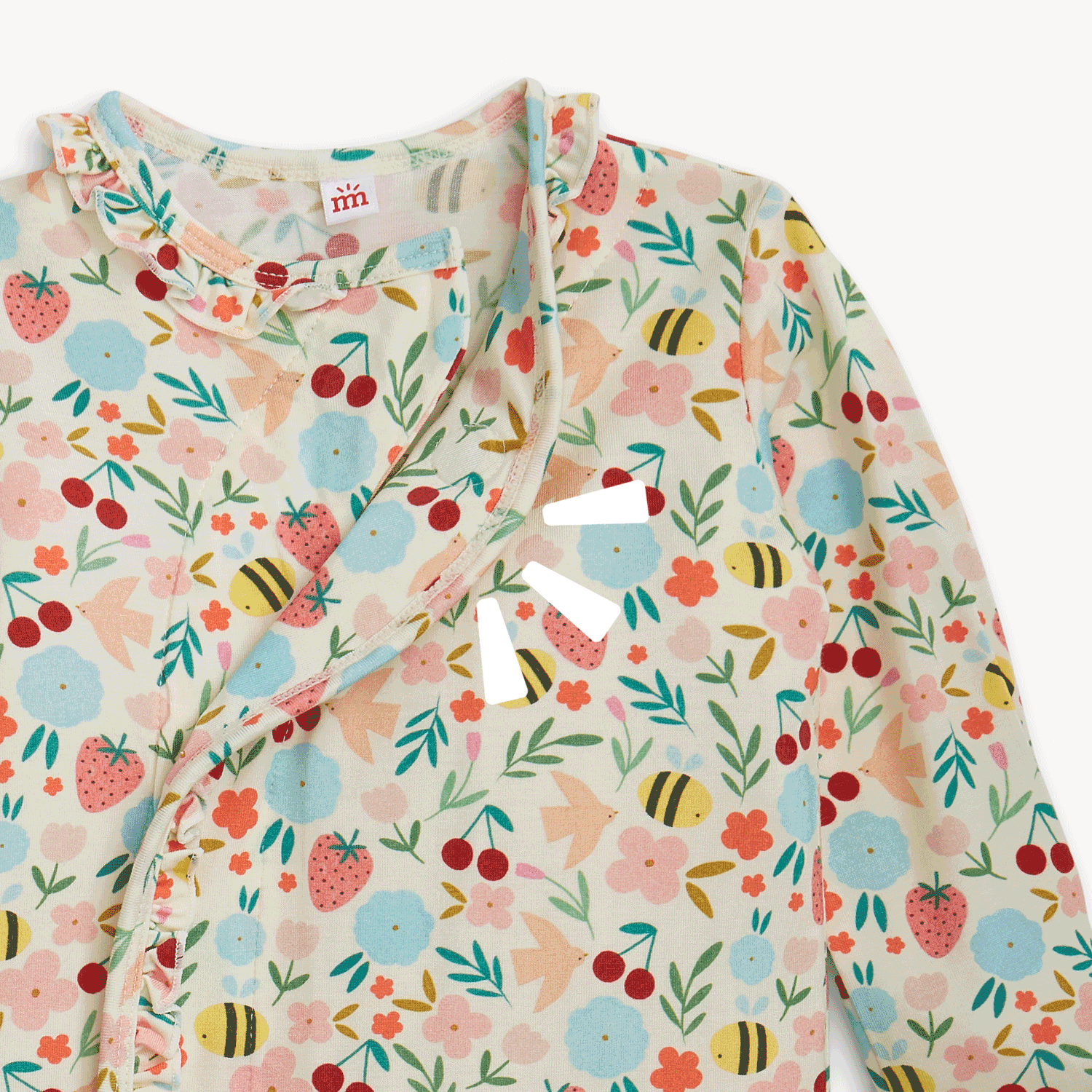 Open and close magnet on the top of A long-sleeve baby gown and matching knotted hat set featuring a garden print of bees, birds, and flowers with a ruffled magnetic closure, by Magnetic Me.