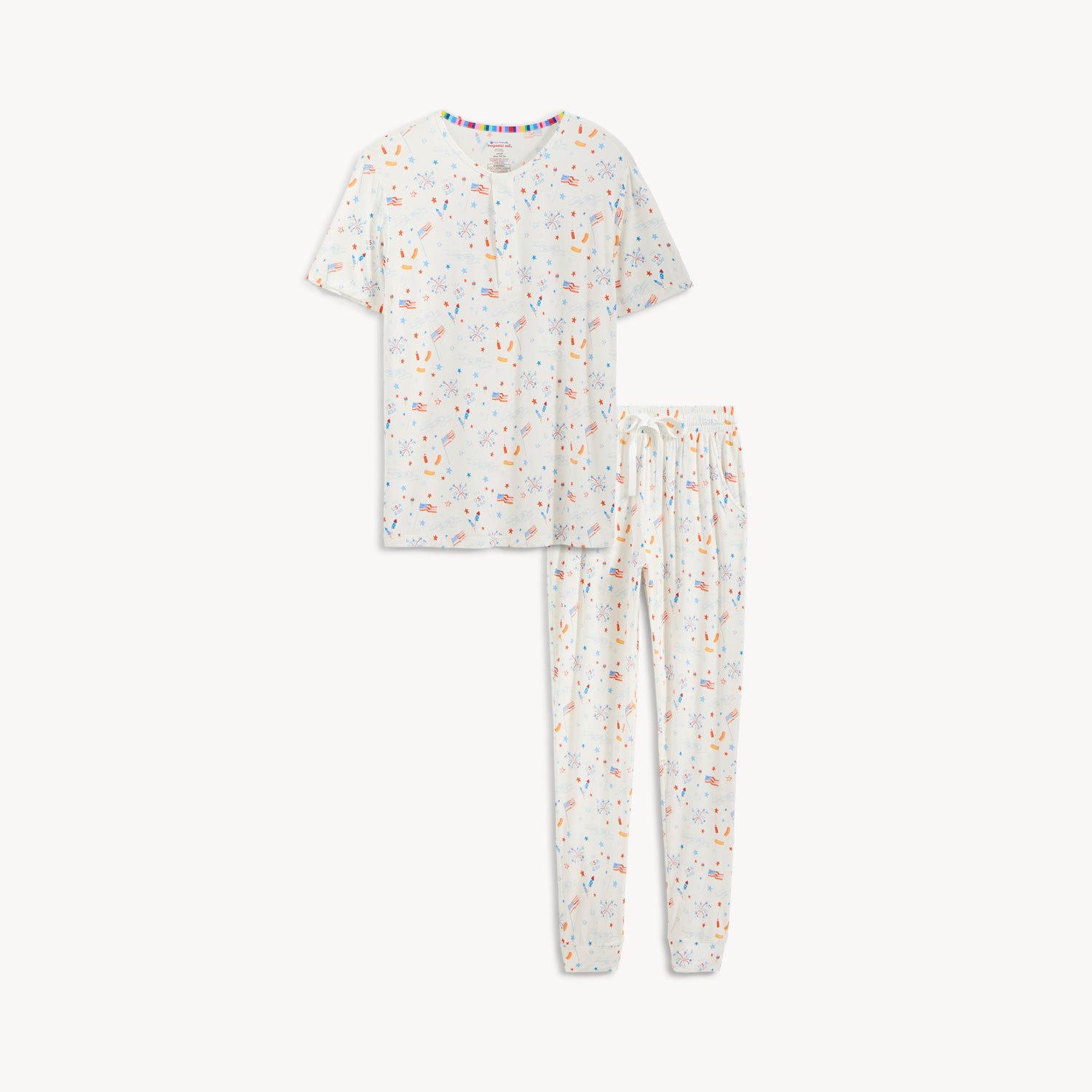 A men's two-piece pajama set including a button-neck short-sleeve top and jogger-style pants in a festive white Fourth of July themed print, by Magnetic Me.