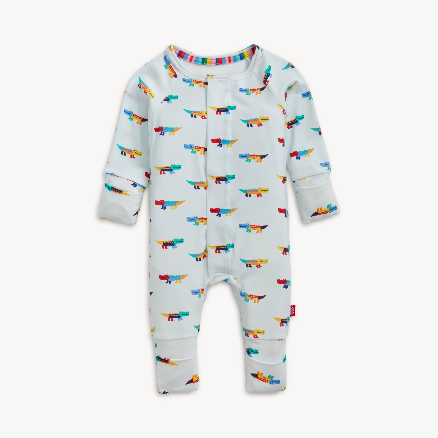 A long-sleeve convertible coverall in light blue featuring an all-over print of colorful, stylized crocodiles and ribbed cuffs, by Magnetic Me.