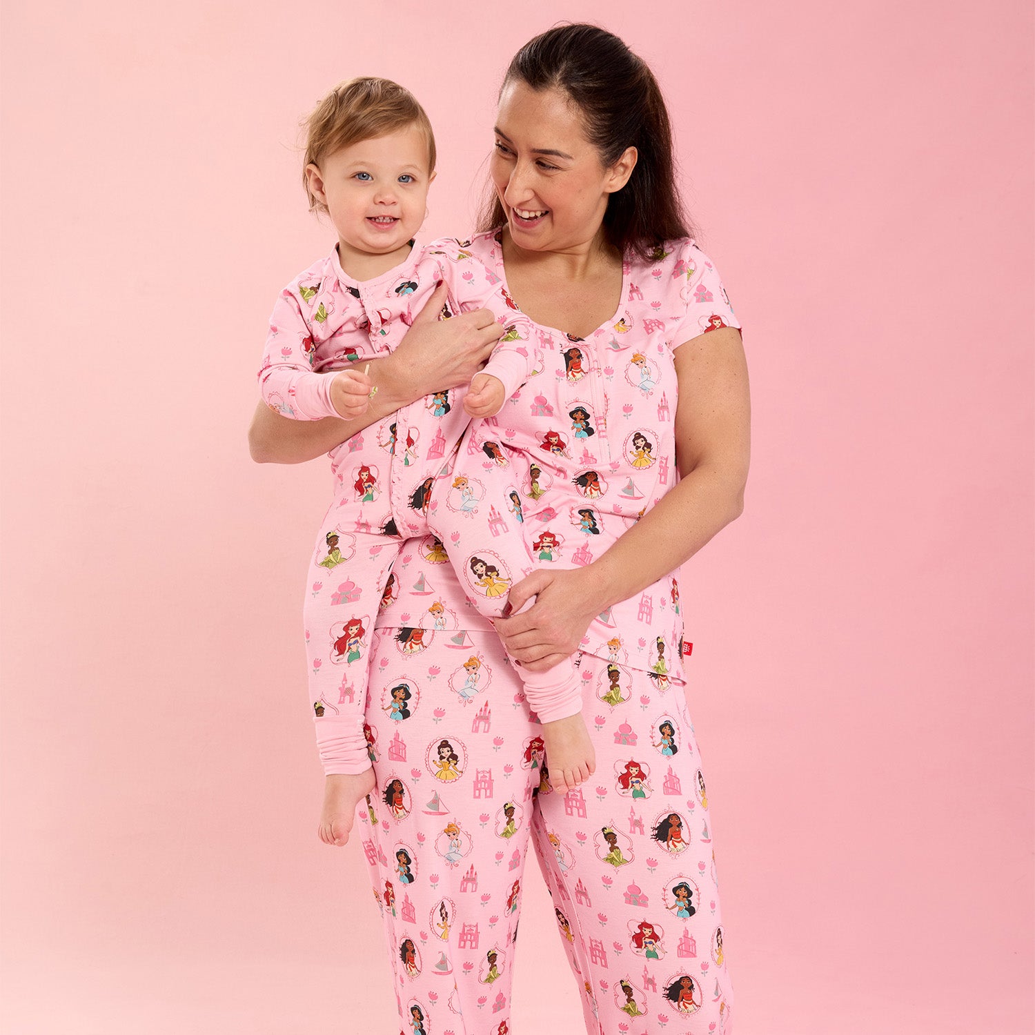 Woman and child wearing matching Princess Royal pink nightwear by Magnetic Me.
