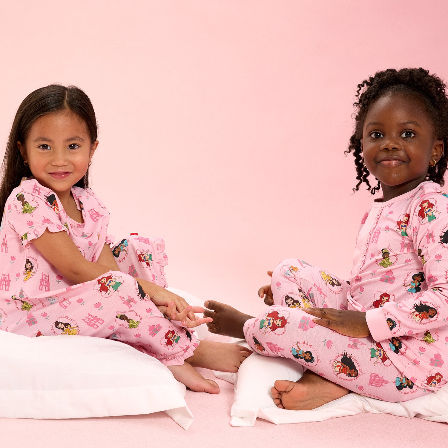 Two children wearing Princess Royal pink matching nightwear, Magnetic Me.