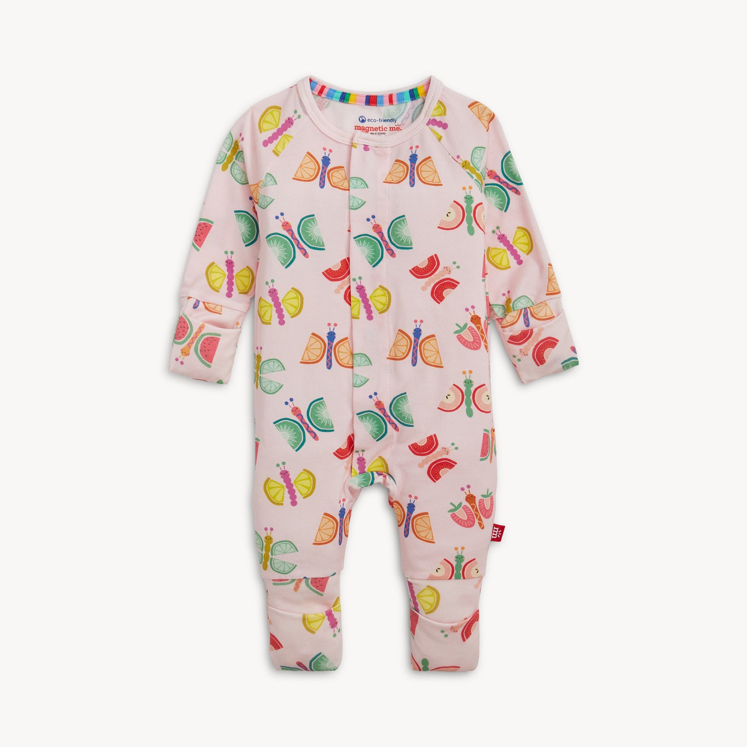 A light pink long-sleeve convertible coverall with cuffed ankles and a repeating pattern of whimsical butterflies made from oranges, kiwis, and watermelons, by Magnetic Me.
