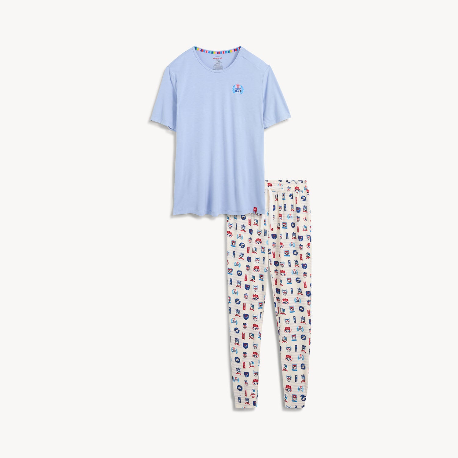 A men's pajama set featuring a solid light blue short-sleeve t-shirt with a small chest logo and matching white striped jogger pants with an all-over patriotic soccer print, by Magnetic Me.