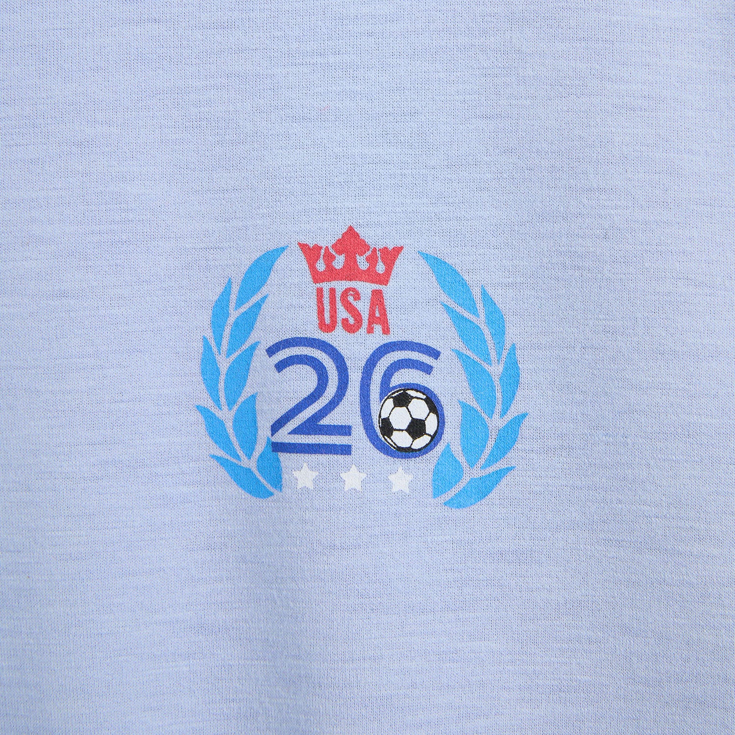 Printed logo on a light blue fabric with 'USA 26' and a soccer ball, by Magnetic Me.