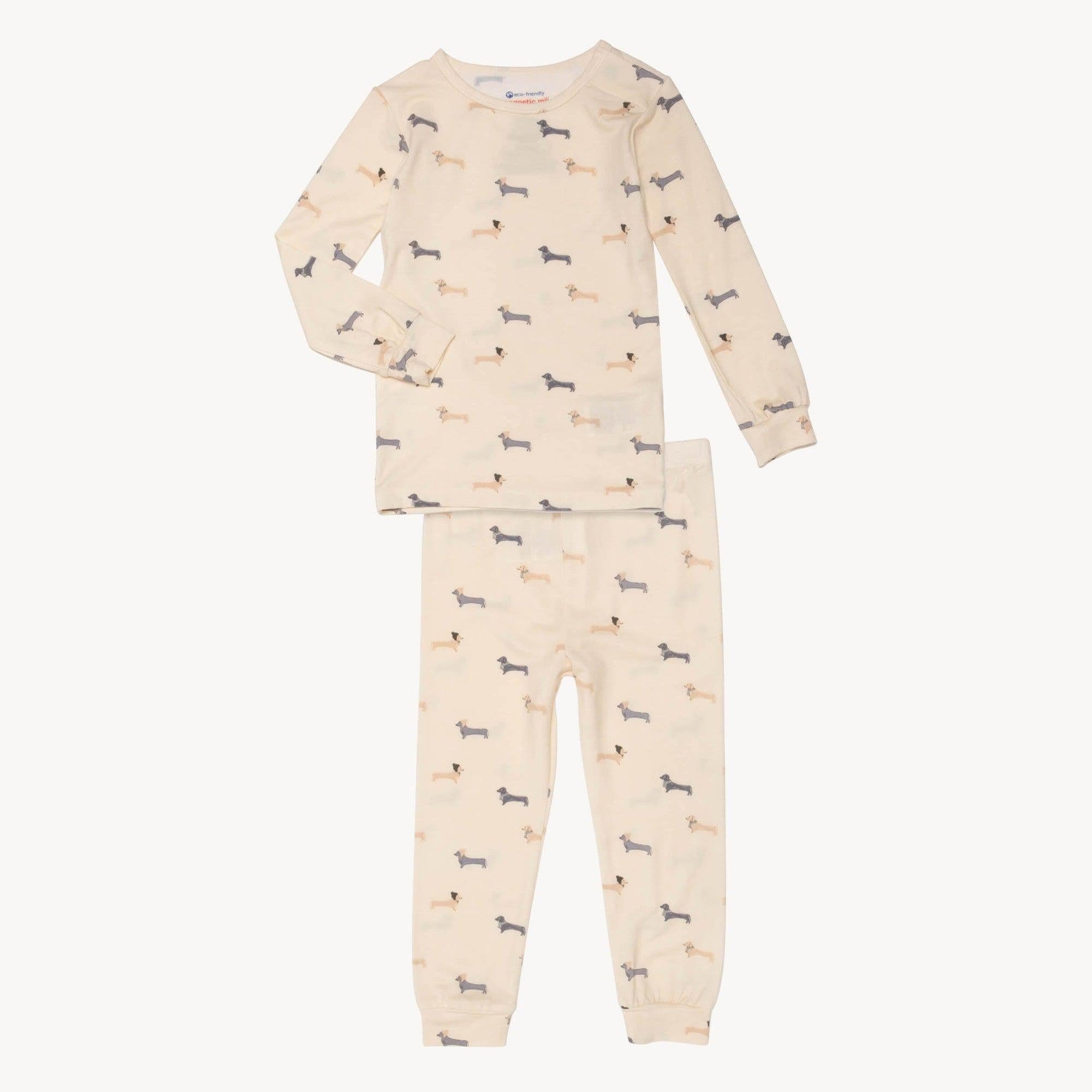 A toddler and kids cream-colored two-piece pajama set with a long-sleeve crewneck top and matching pants featuring a 