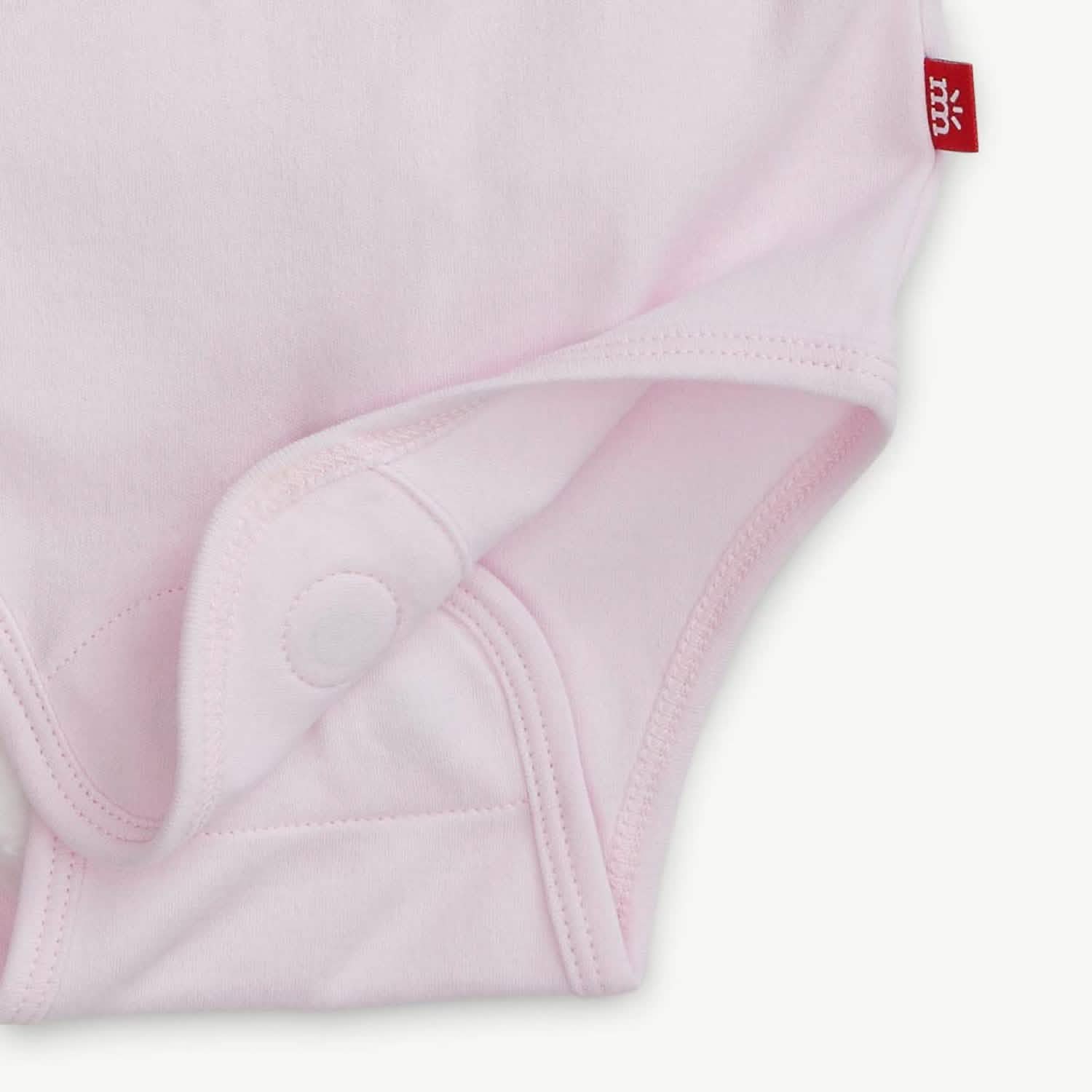 soft petal pink organic cotton magnetic bodysuit